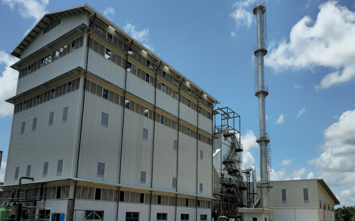 Industrial utility building against a clear blue sky